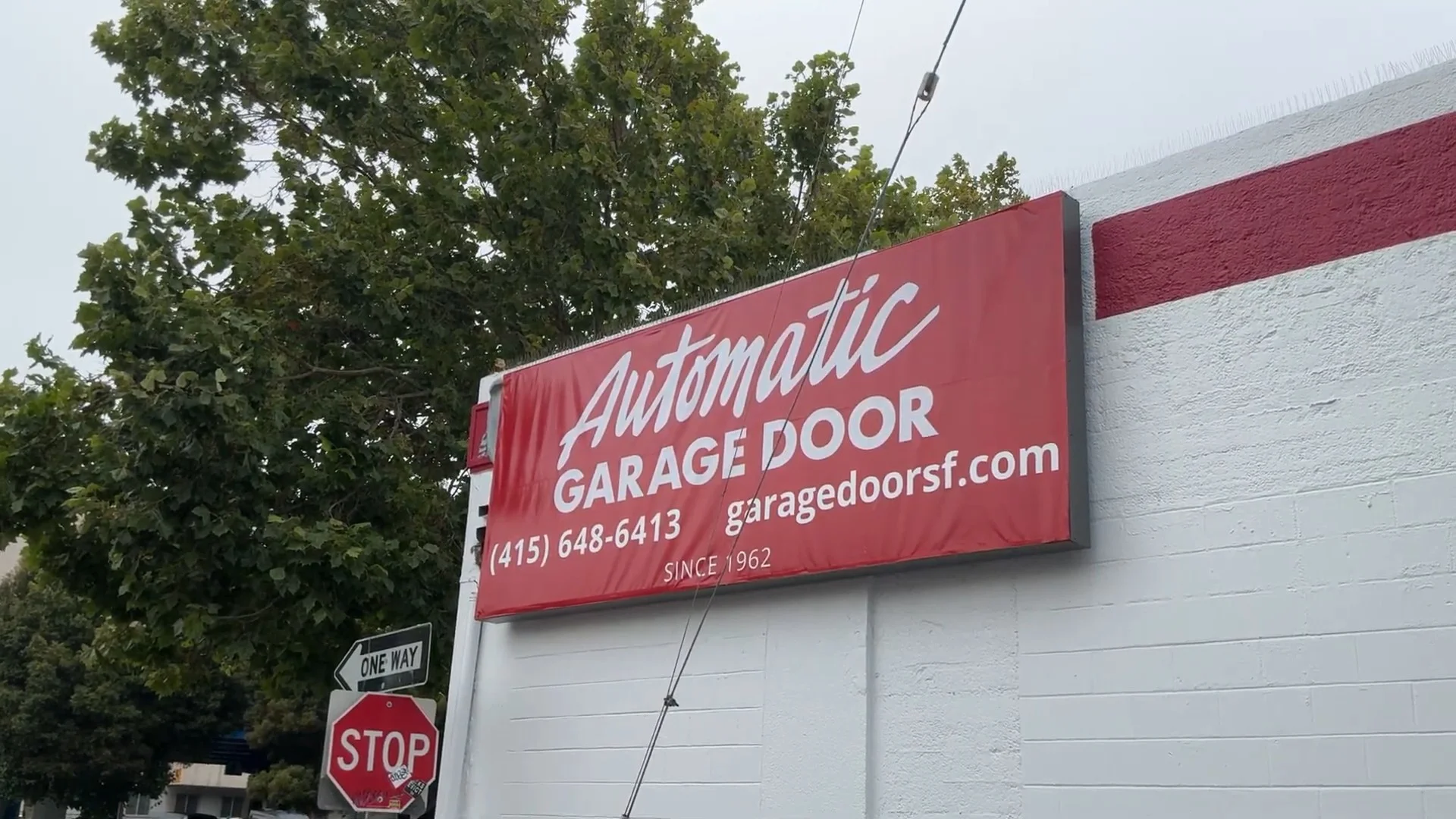 Exterior store sign for Automatic Garage Door offering complete garage door services in San Francisco CA.